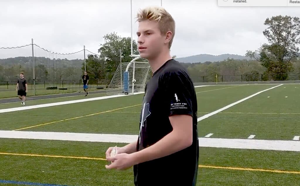 student at the turf field